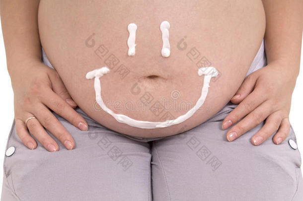肚子里的孕妇。 护理孕妇腹部皮肤剪贴