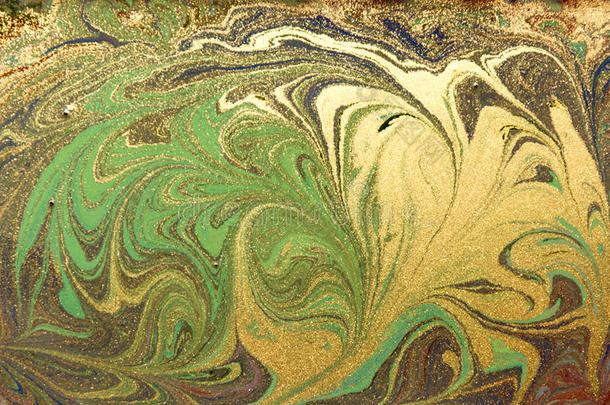 <strong>绿色</strong>和金色的液体质地。 <strong>手绘</strong>大理石花纹背景。 墨水大理石抽象图案