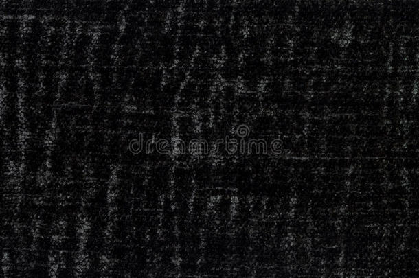 黑色蓬松背景的柔软，蓬松的布。 纺织品特写的纹理