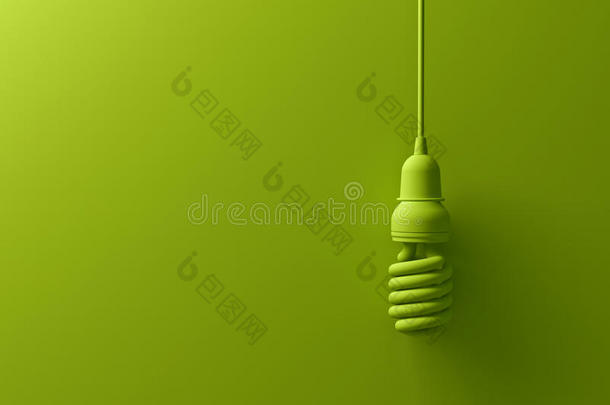 绿色生态节能紧凑型荧光灯灯泡悬挂在绿色背景上