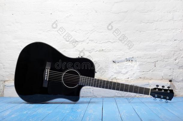 音乐的仪器-黑的听觉的吉他砖背景