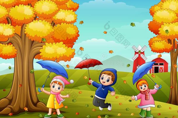 幸福的孩子们演奏和伞采用农场风景