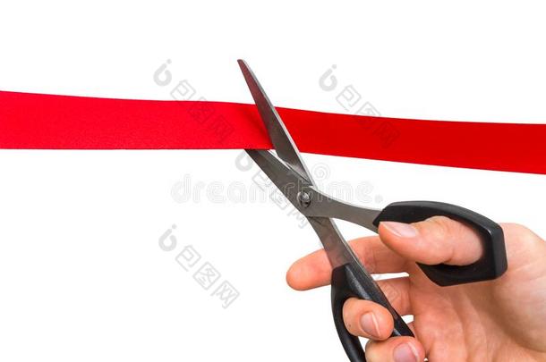 手和剪刀锋利的红色的带-开幕典礼