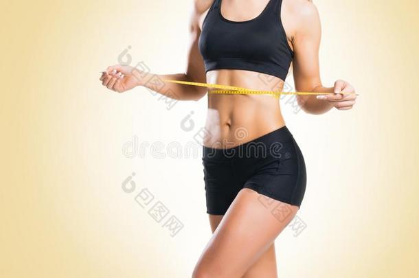 适合,健康的和像<strong>运动</strong>家的女人采用<strong>运动</strong>装measur采用g她身体<strong>我</strong>