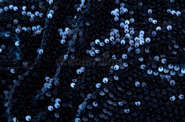 矩形的黑暗的蓝色发光的织物和闪光装饰片
