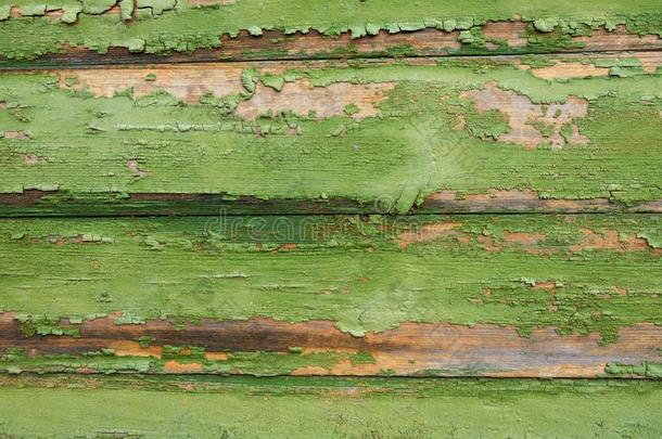 背景.老的水平的木板和剩余部分关于绿色的颜料