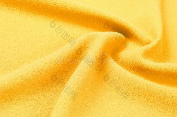 质地,背景,模式.黄色的丝织物.光滑的优美的