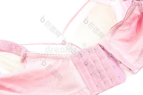 粉红色的胸罩向白色的背景关闭在上面粉红色的胸罩向白色的后座