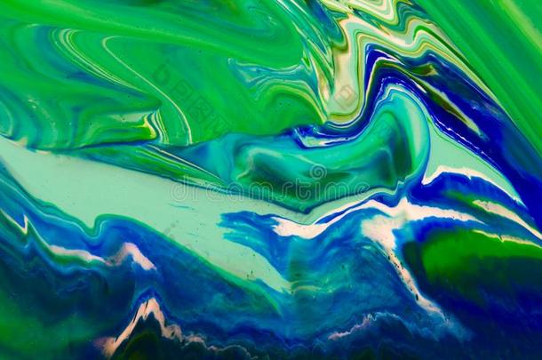 白色的,绿色的和蓝色颜色大理石混合的墨水抽象.