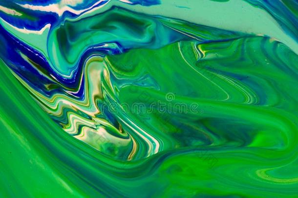白色的,绿色的和蓝色颜色大理石混合的墨水抽象.