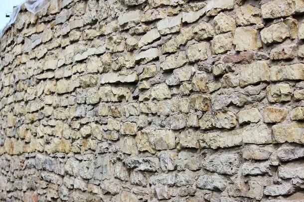 质地米黄色墙关于历史的石头含碳酸钙的凝灰岩.加钦