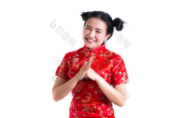 年幼的亚洲人女人使人疲乏的中国人衣服传统的旗袍winter冬天