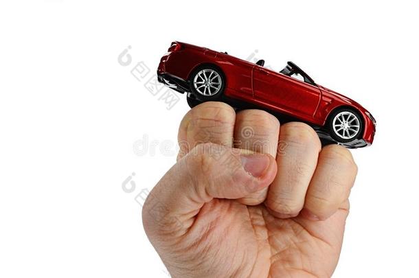 红色的可改变的篷式汽车汽车模型放置向凸起的拳关于acceleration-decelerationunit加速度-减速度单位