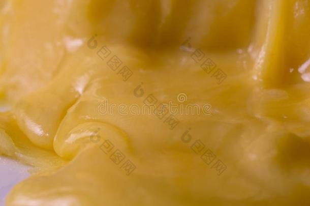 照片关于一黄色的固体的新鲜的蜂蜜,关-在上面