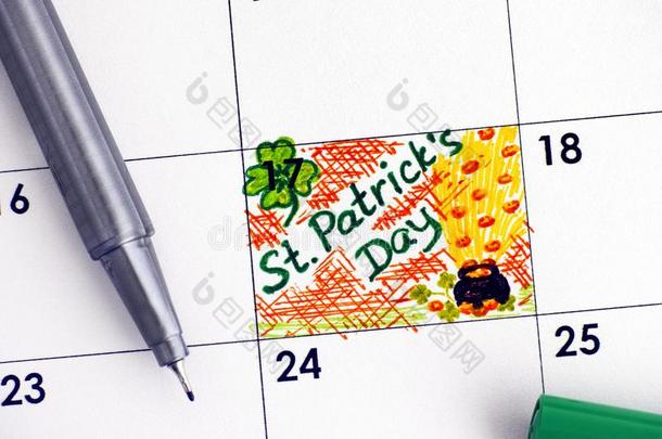 令人回忆起的东西SaoTomePr采用cipe圣多美和普林西比.人名一天采用日历和绿色的笔.