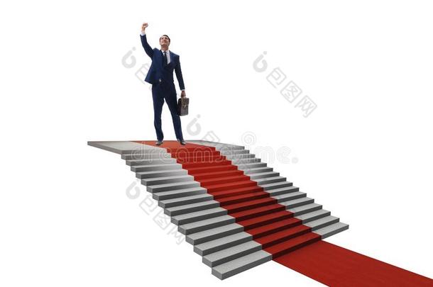 年幼的商人攀登的楼梯和红色的地毯向白色的后面