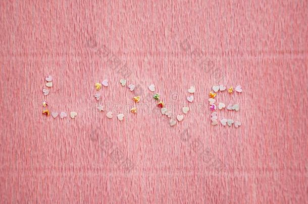 爱单词使关于闪光装饰片,闪烁和五彩纸屑向粉红色的后台