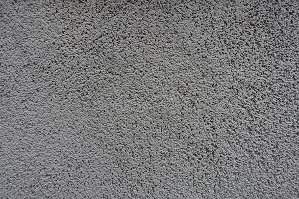 表面关于粒状的灰色墙前面看法