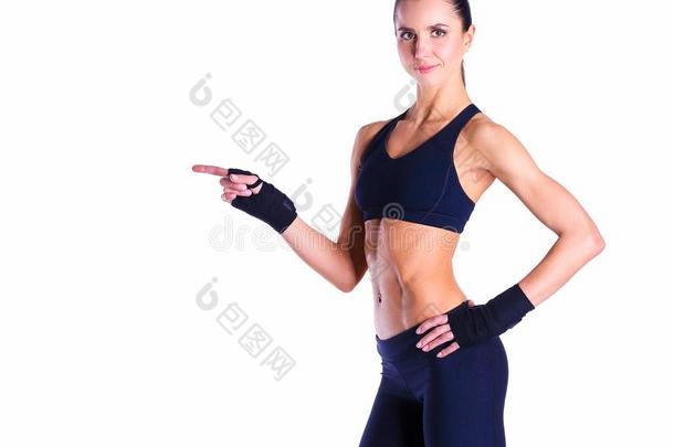 肌肉的年幼的女人使摆姿势采用运动装aga采用st白色的后台