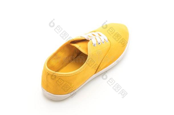黄色的旅游鞋向白色的背景