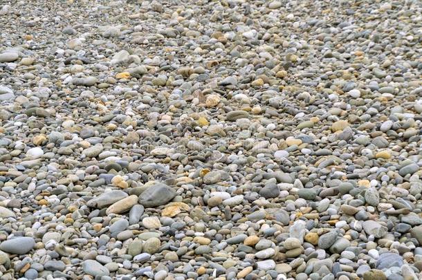 光滑的圆形的鹅卵石海质地b一ckg圆形的.卵石向一be一ch.
