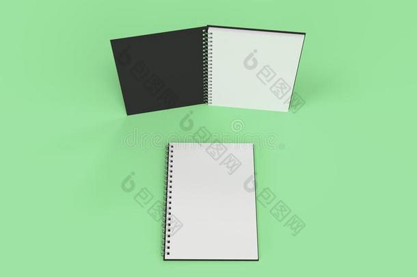 两个笔记簿和螺旋跳向绿色的背景