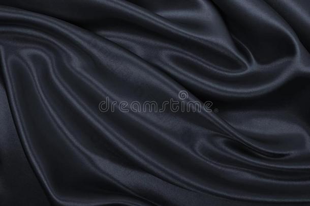 光滑的优美的黑暗的灰色的丝或缎质地同样地抽象的后面