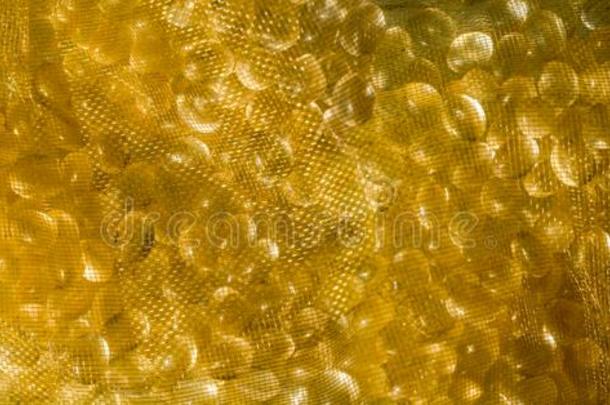 金色的背景使关于网孔和硅树脂小颗粒