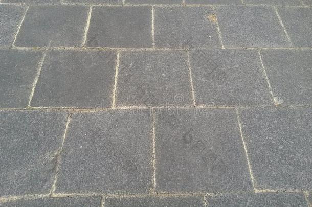 灰色的块石面路厚板出局关于具体的和明亮的