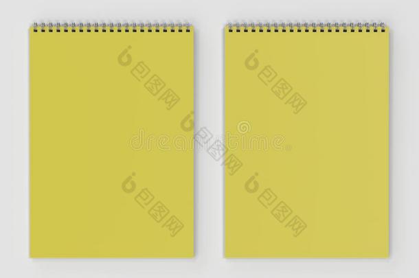 空白的黄色的笔记簿和金属螺旋跳向白色的后座