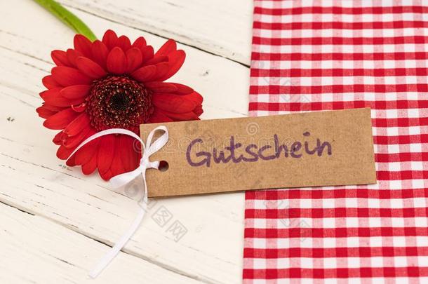 红色的花和赠品加标签于和德国的单词,代金券,方法担保