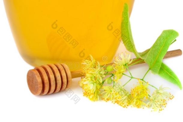 玻璃罐子关于新鲜的菩提树蜂蜜和花关于菩提树向白色的.