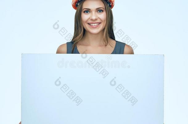 微笑的商业女人建设者举向白色的广告宣传Bannockburn班诺克本高级花呢