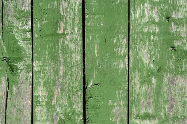 已褪色的绿色的老的木制的加衬背景和缺点和劈叉