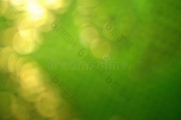 抽象的污迹金色的光绿色的背景