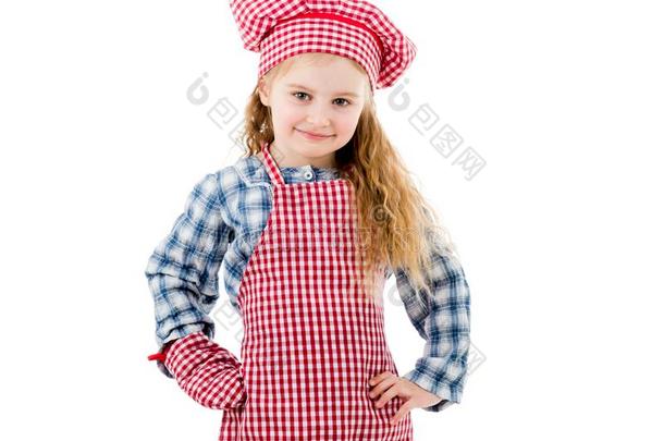 快乐的小的女孩采用红色的围裙隔离的向白色的背景