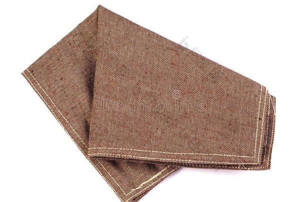 摺皱的桔子棕色的多变的餐巾表衣服向白色的英语字母表的第2个字母