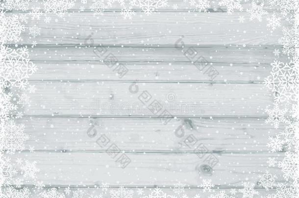 木制的灰色的圣诞节背景和框架关于白色的雪花,
