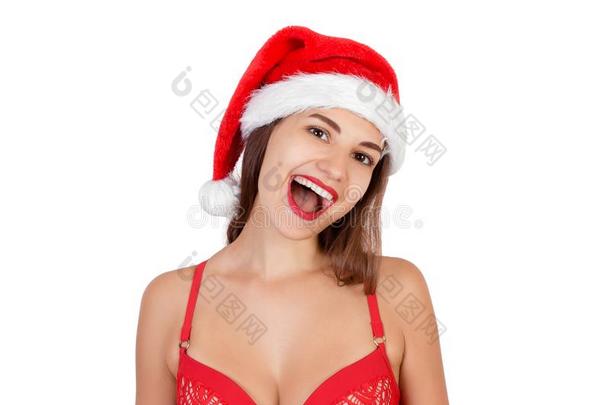 表现强烈情感的微笑的女孩使人疲乏的圣诞节帽子.表现强烈情感的女人采用