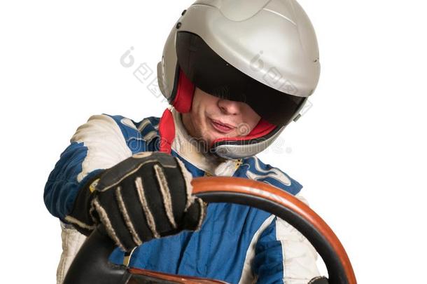 赛跑汽车驾驶员采用指已提到的人头盔在期间driv采用g.向一白色的b一ckgrou