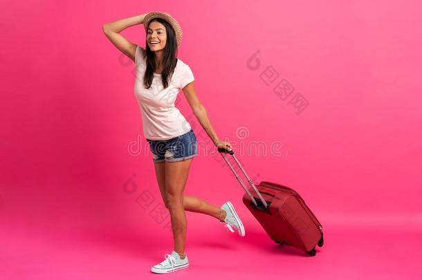 女人旅行支票和手提箱向颜色背景.