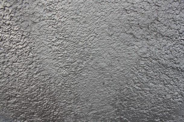 老的蹩脚的质地,灰色具体的墙,抽象的背景关于一