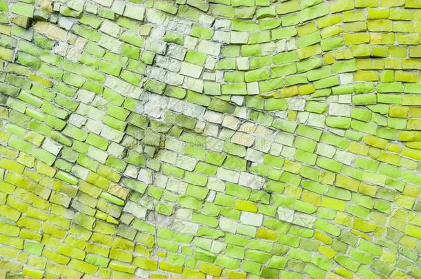 光绿色的表面关于老的弄碎抽象的装饰的马赛克