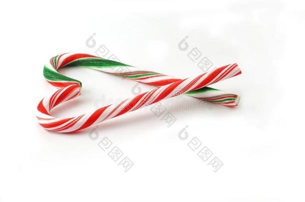圣诞节糖果手杖和红色的和绿色的弓隔离的向白色的波黑