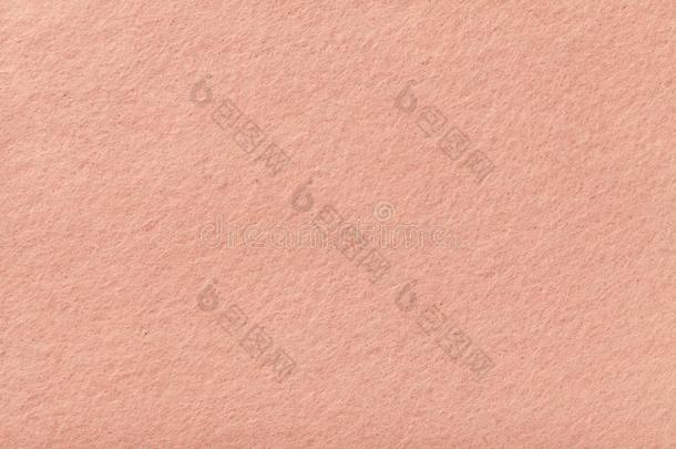 光粉红色的表面暗淡的绒面革织物特写镜头.丝绒质地关于毛毡.