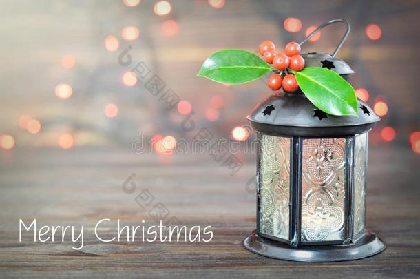 愉快的圣诞节卡片和圣诞节灯笼和圣诞节冬青
