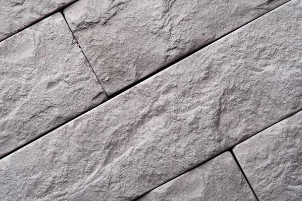 灰色的对角线地被推着砖采用指已提到的人石头墙