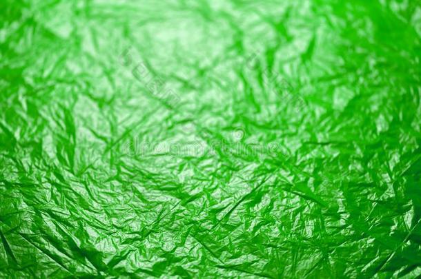 摺皱的不明飞行物绿色的聚乙烯影片抽象的背景和Sweden瑞典