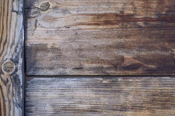一墙关于老的粗略地加工过的木制的板关于灰色的和棕色的