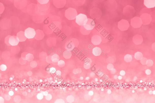 抽象的粉红色的焦外成像光背景.粉红色的玫瑰发火花的闪烁